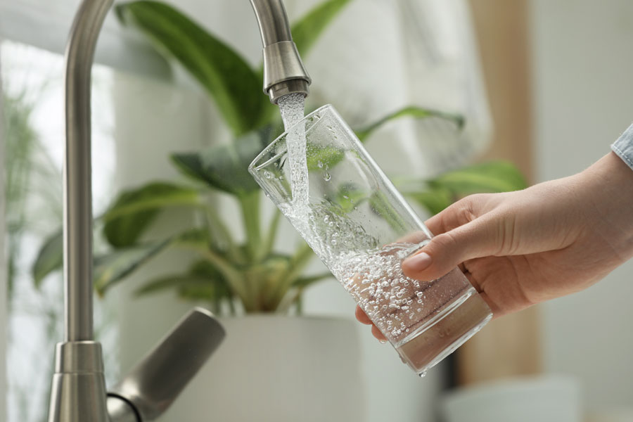 Woman Filling Water Glass